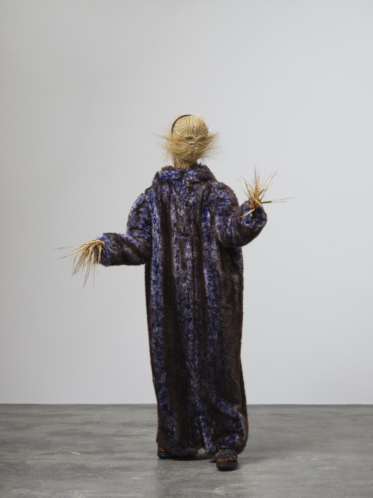 Rasmus Myrup, <em>The Rye Bitch [Rugkællingen]</em>, 2021, Rye, rye bread, silk and mohair rope, imitated bear skin coat, nail polish, hairband, shoes, aluminium, wood, plastic, hardware, 177 × 123 × 97 cm